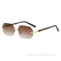 New European and American fashion frameless polygon Sunglasses Women's gradually changing color Sunglasses trend wood grain leg